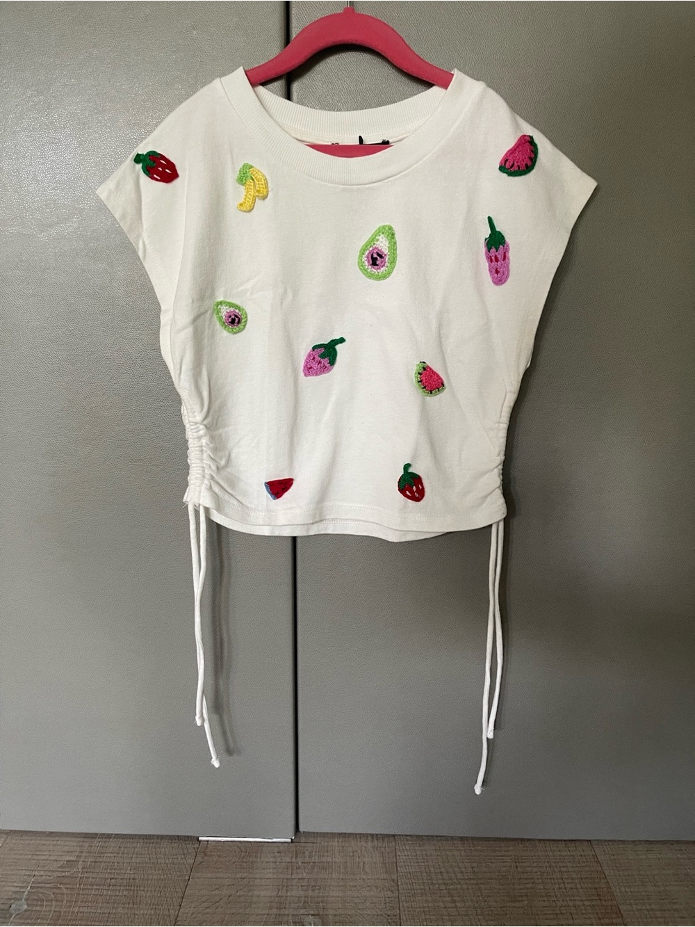 White Top with Handcrafted Fruit Appliqués and Ruched Detail